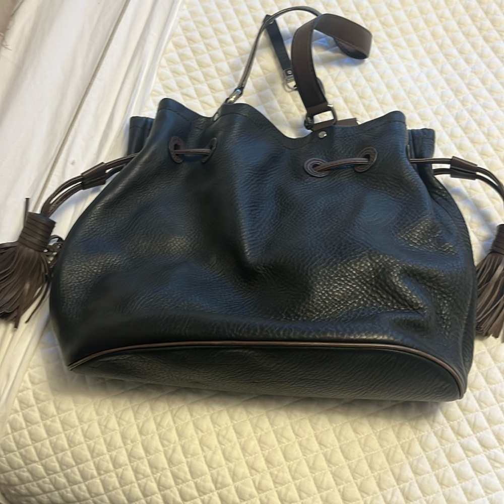 Beautiful drawstring leather bag black body brown straps and tassel